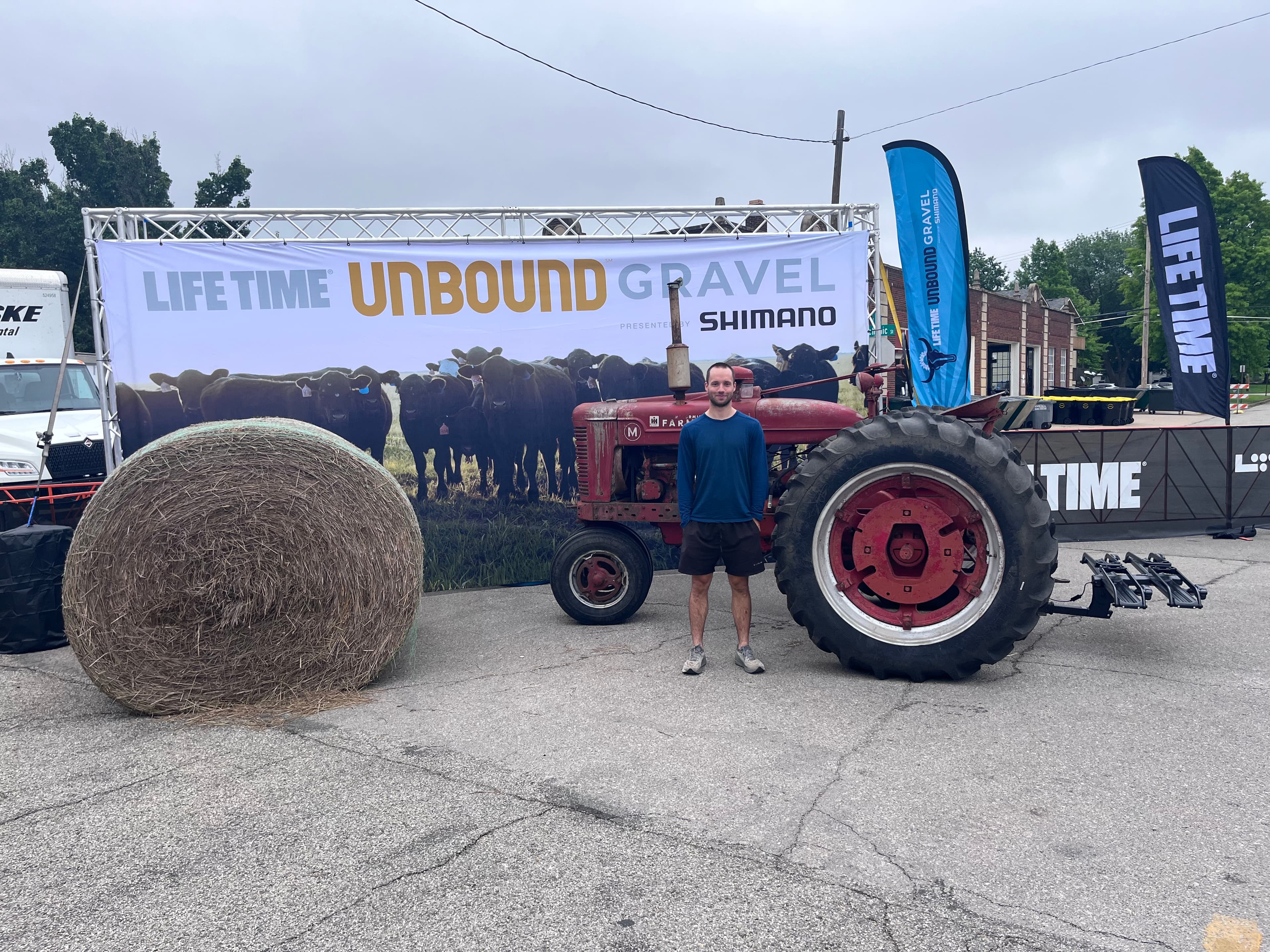 Pre-race, still clean, in front of the Unbound Gravel banner